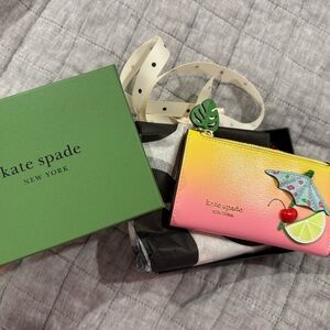 Limited edition Kate Spade Pink and Yellow Wallet with Umbrella Design.